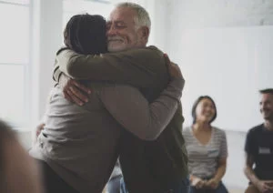 Two people showing gratitude during recovery