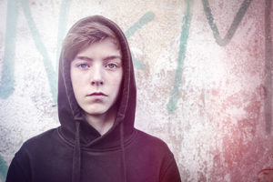 Boy teenager experiencing depression from marijuana use